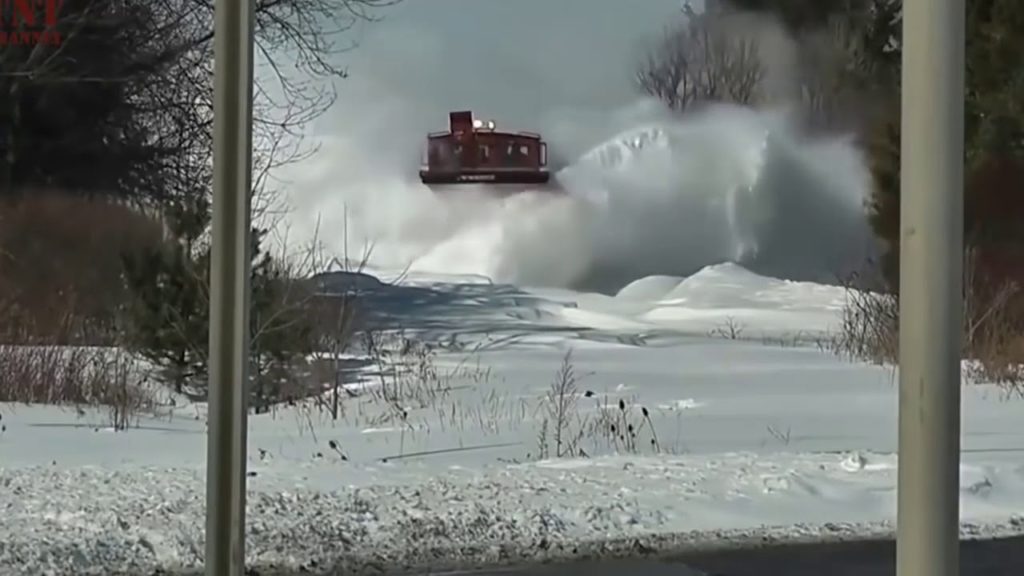 Awesome Powerful Train plow through Snow Railway Tracks