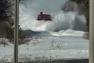 Awesome Powerful Train plow through Snow Railway Tracks